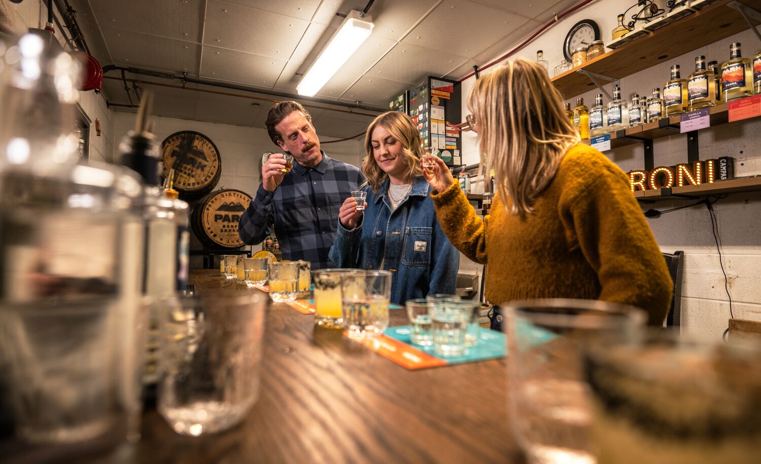 Three people trying gin during the Blend your Own Gin experience at PARK Distillery.